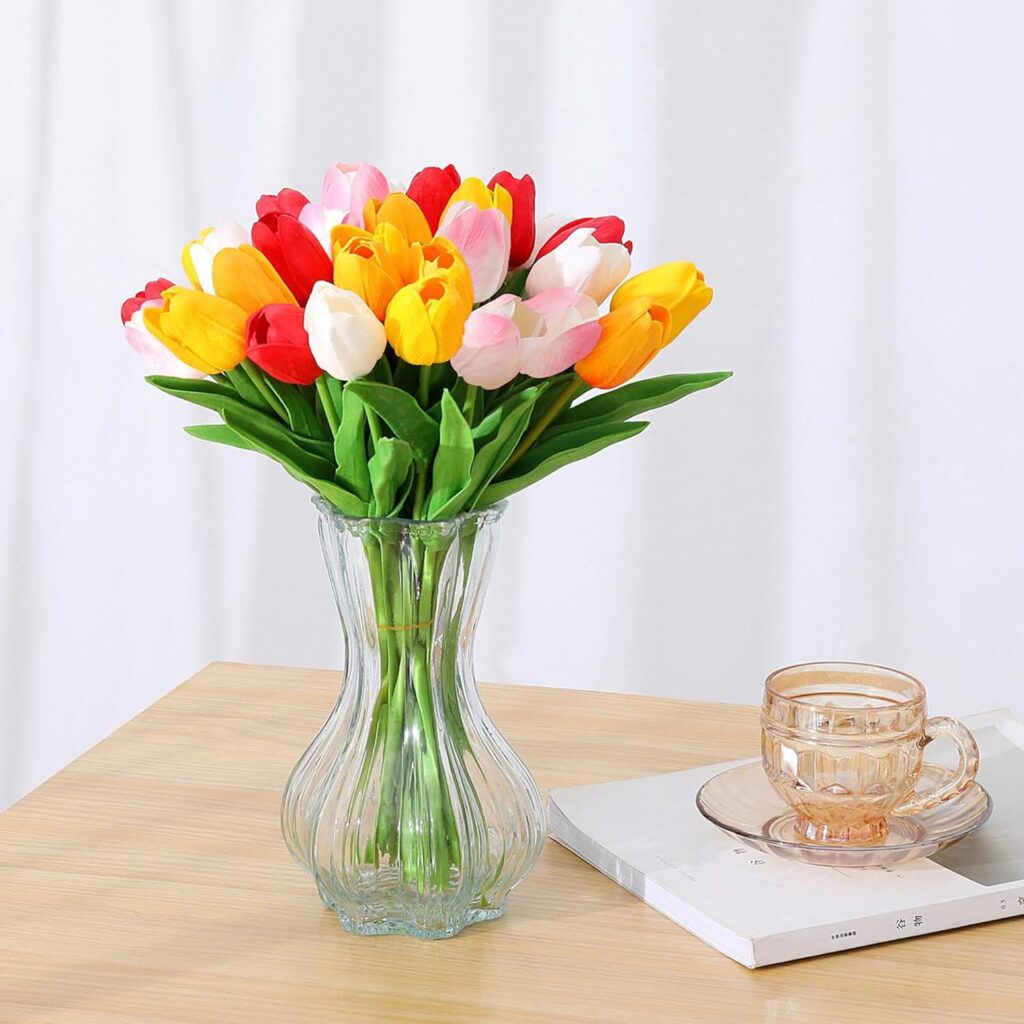 silk tulips in vase on table