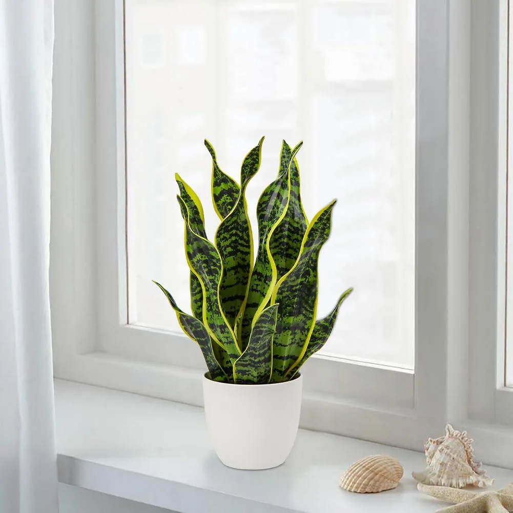Tall narrow artificial snake plant from Hollyone in dark pot
