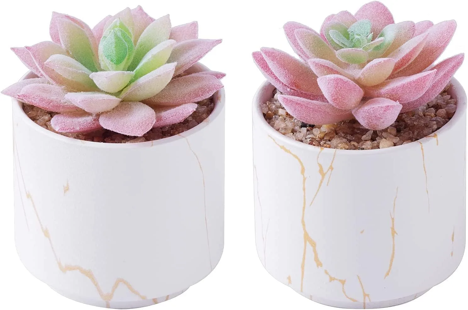 Two mini artificial succulent plants in white ceramic pots on a desk