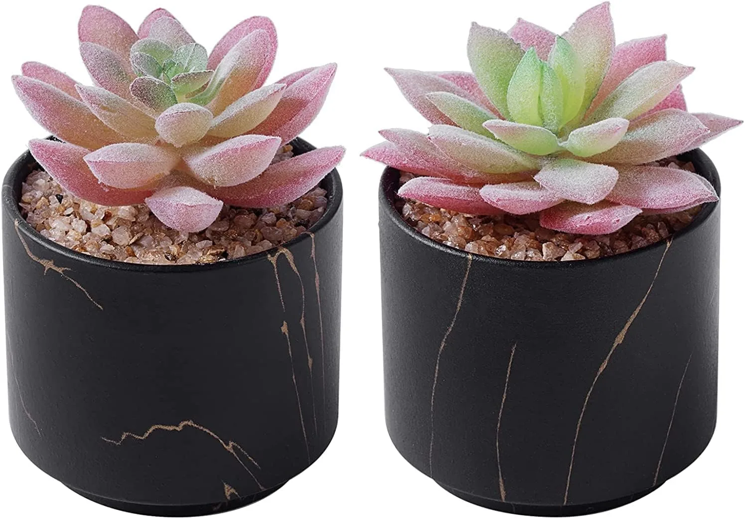 Pair of artificial succulents in black ceramic pots on a wooden desk
