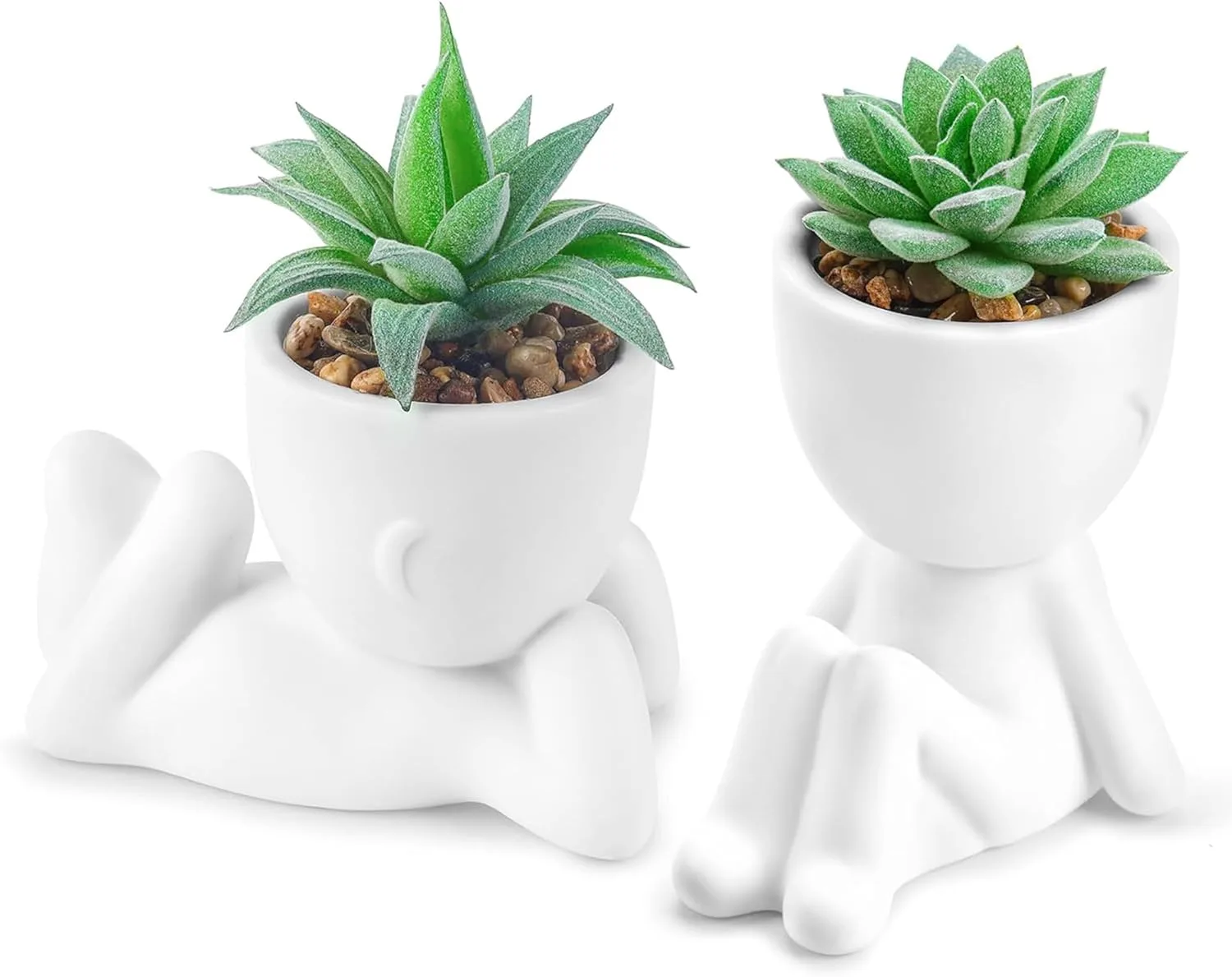 Two mini artificial succulent plants in modern light-colored pots on a home office desk